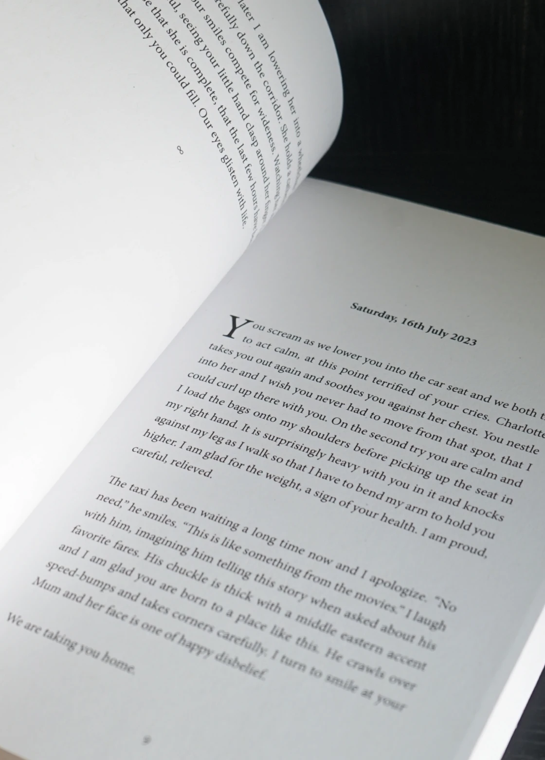 An open paperback journal: an entry under its date, with a drop cap